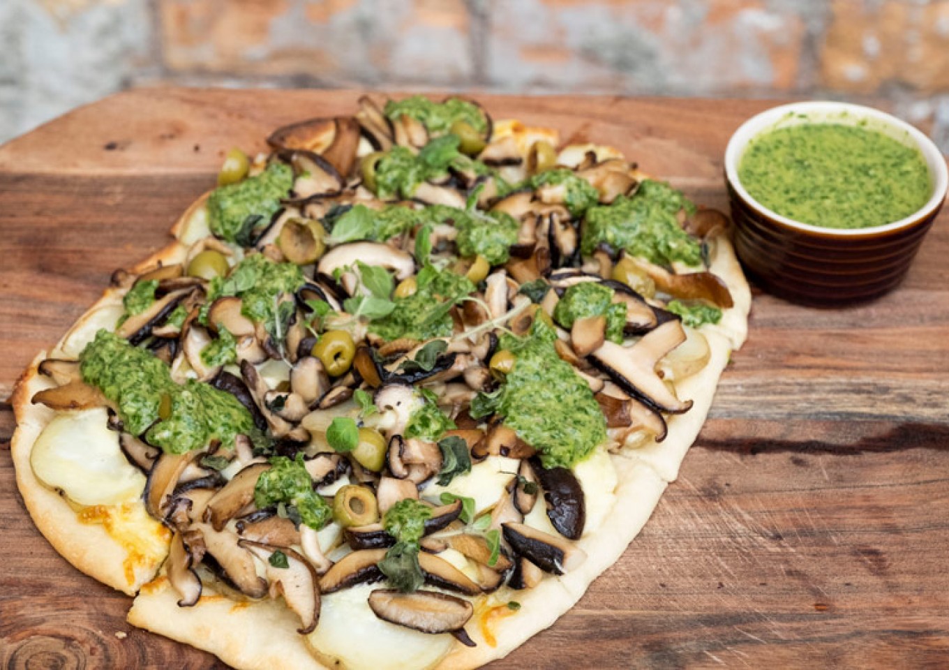 Shiitake, green olive & potato Pizza with rocket salsa verde